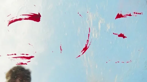 A request for help, in the form of the SOS distress signal, is washed away by Stock Footage 315355362
