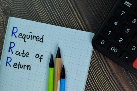 Required Rate of Return write on a book isolated on office desk. Stock Photos