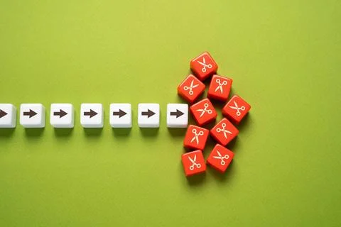 A requirement to cut back on some work, processes, or expenses. Reduce com... Stock Photos