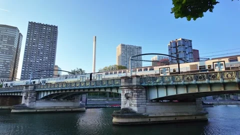 RER train crossing Pont Rouelle bridge at sunrise in Paris, France Stock Footage 336251424