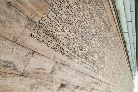 Res Gestae Divi Augusti placed on the back of the Museum of the Ara Pacis in Rom Stock Photos