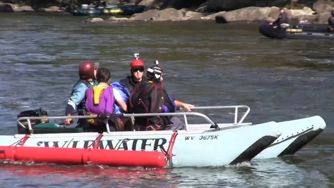 Rescue boat getting Parachutists after jumping from New River Gorge Bridge Video stock 86476868
