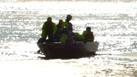 Rescue boat in winter facing camera whil... | Stock Video | Pond5