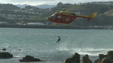 Rescue copter hovers over windswept sea Stock Footage 753022