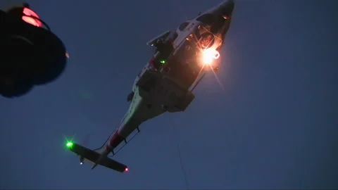 Rescue helicopter of SAR training after twilight. 動画素材 107315436