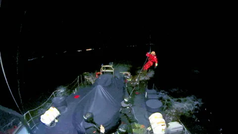 Rescue helicopter of SAR training after twilight. Stock Footage 107315733
