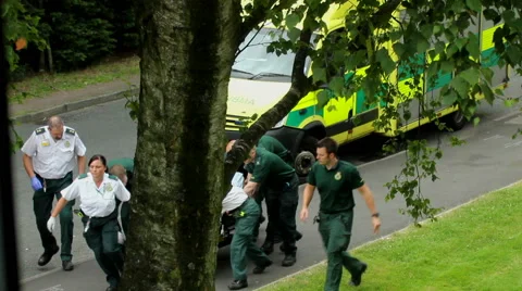 Rescue operation. Group of paramedics pushing the patient on the trolley 2 Stock Footage 40609401