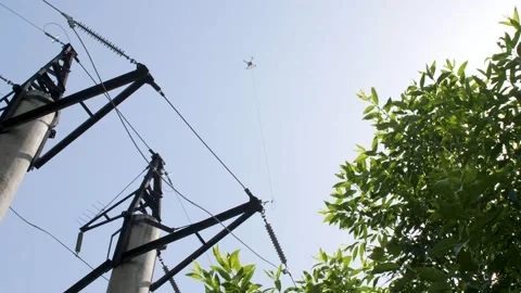 Rescue operation to rescue a quadcopter caught in wires. Video stock 156649932