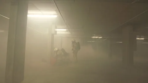 Rescue operation in smoke in an empty parking lot Stock Footage 266409093