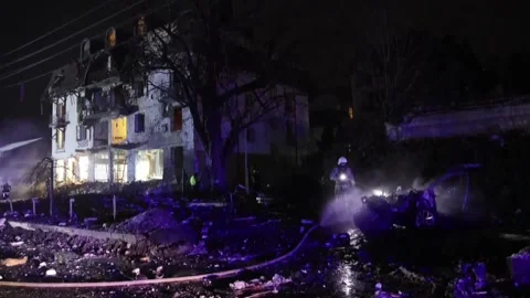 Rescue operations underway after destructive rocket attack on city hotel in Khar Stock Footage 260988987
