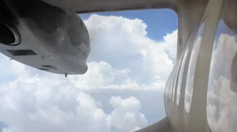 Rescue plane windows, plane flying between clouds Stock Footage 52348040