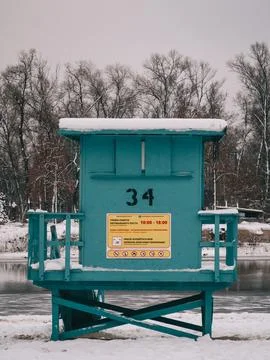 Rescue post on the winter beach by the river Stock Photos