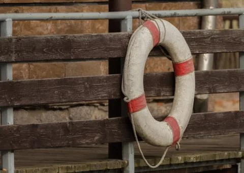 A rescue ring hangs on the bridge Foto stock