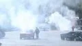 Rescue team extinguishes car fire, stunt show, sporting event HD Footage