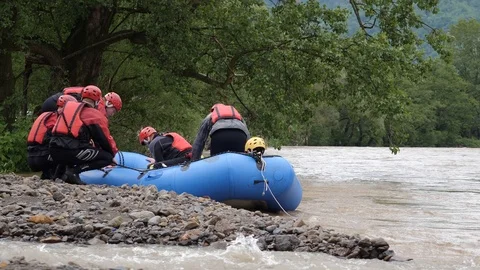 A rescue team getting ready to go to a rescue mission to find a person Stock Footage 120140858
