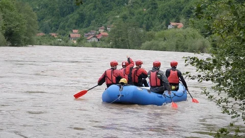 A rescue team heading to the place where a person fell into the swollen river Video stock 120140920