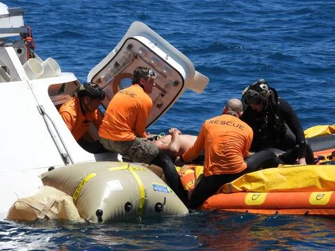 Rescue team members are using a Boeing CST-100 Starliner training capsule t.. Stock Photos