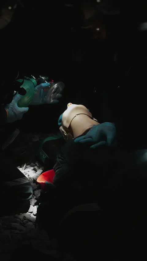 Rescue Team Practicing Emergency Ventilation on Training Mannequin. Stock Footage 345559178