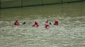 Rescue team in red jackets, helmets swimming in water getting ready for training HD Footage