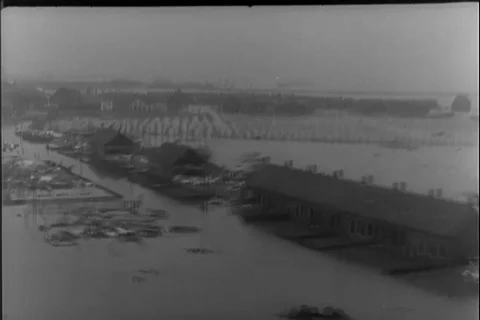 Rescue team throws supplies and lifeboat at flood affected areas - 1953 Stock Footage 117665693