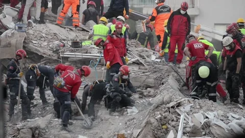 Rescue work is on for survivors in a collapsed building. Vídeos de archivo 142474526