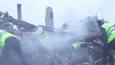 Rescue workers dismantle the rubble after the earthquake Stock Footage