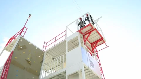A  rescuer climb up  using a rope 1 Stock Footage 319501417