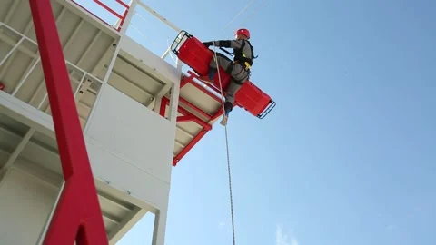 A  rescuer climb up  using a rope 4 Video stock 319501413