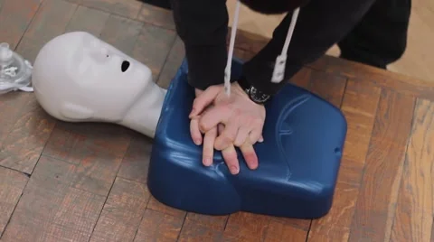 The rescuer does chest compressions. First Aid. Training of Lifeguards. Stock-Footage 54413767