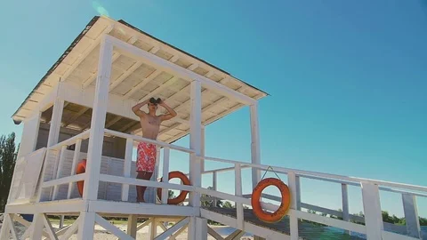 The rescuer runs to help the drowning man. Slow shooting of 120fps. Stock Footage 76303699
