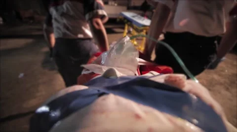 Rescuing injured on stretcher Stock Footage