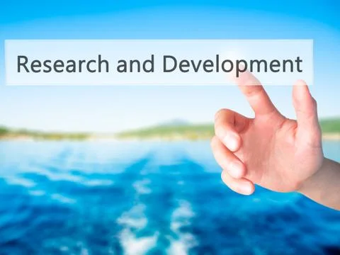 Research and Development - Hand pressing a button on blurred background conce 스톡 사진