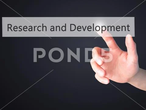 Research and Development - Hand pressing a button on blurred bac Stock Photos