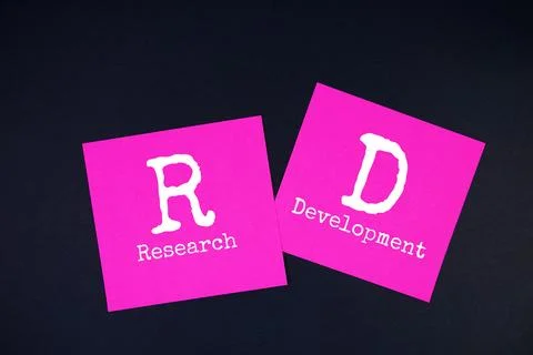 Research and Development (RD) text message on stick note on black background Stock Photos