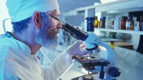 Research Chemist Analyzing Chemical Samples in High-Tech Laboratory at Twilight Stock Footage 281313047