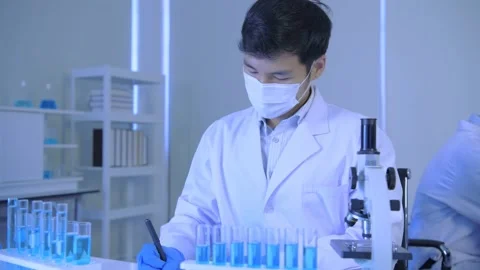 Research concept of 4k resolution. Asian scientists are examining the anomaly Stock Footage 152761206