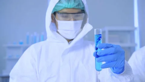 Research concept of 4k resolution. Scientists are examining the solution in a Stock Footage 152761148