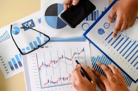 Research documents with analytics data Brainstorm Meeting Businessman financi Stock Photos