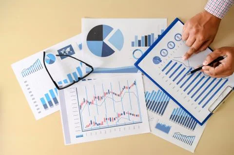 Research documents with analytics data Brainstorm Meeting Businessman financi Stock Photos