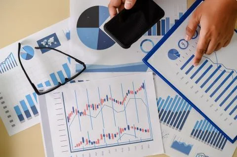 Research documents with analytics data Brainstorm Meeting Businessman financi Stock Photos