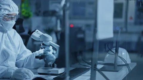 Research Factory Cleanroom Engineer Scientist Uses Microscope to Inspect Samples Stock Footage 126151925