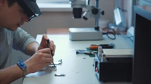 Research Laboratory, robotics engineer checks the operation of the microchip 스톡 동영상 105971080