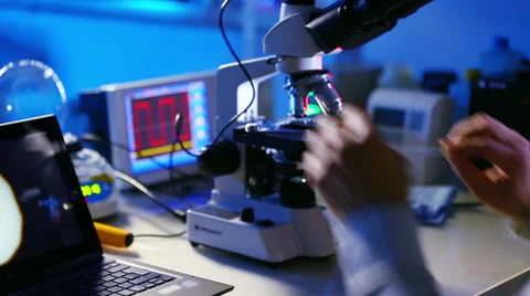 Research on microscope samples found at the crime scene Stock Footage 35556850