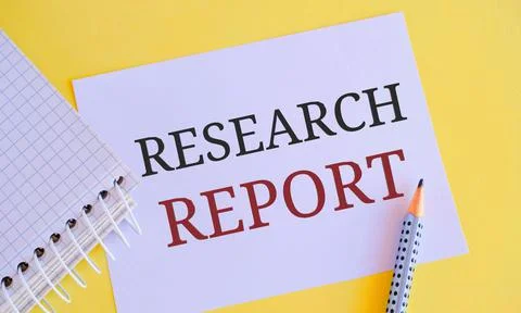 Research Report text written on a notebook with pencil. Concept of objective Stock Photos