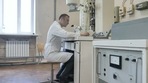 Research Scientist Looks Into Electronic Microscope In Laboratory Stock Footage 156749086