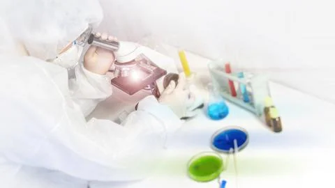 Research  scientist using a microscope in a laboratory, Concept science and T Stock Photos