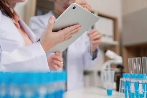 Research Scientist Using Tablet for Data Collection in Chemistry Lab A res... Stock Photos