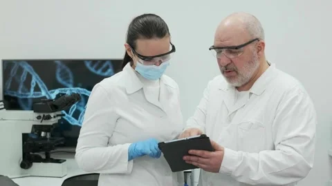 Research scientists are experimenting with the concept of laboratory Stock Footage 269348586