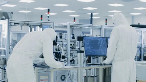  Research Scientists Work with Microscope and on Personal Computer. Stock Footage 93224974