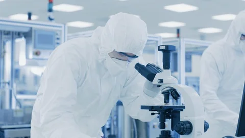Research Scientists Work with Microscope and on Personal Computer in Laboratory. Stock Footage 93226127